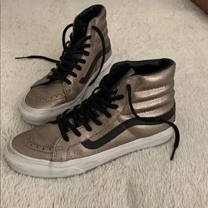 Vans rose gold high tops.